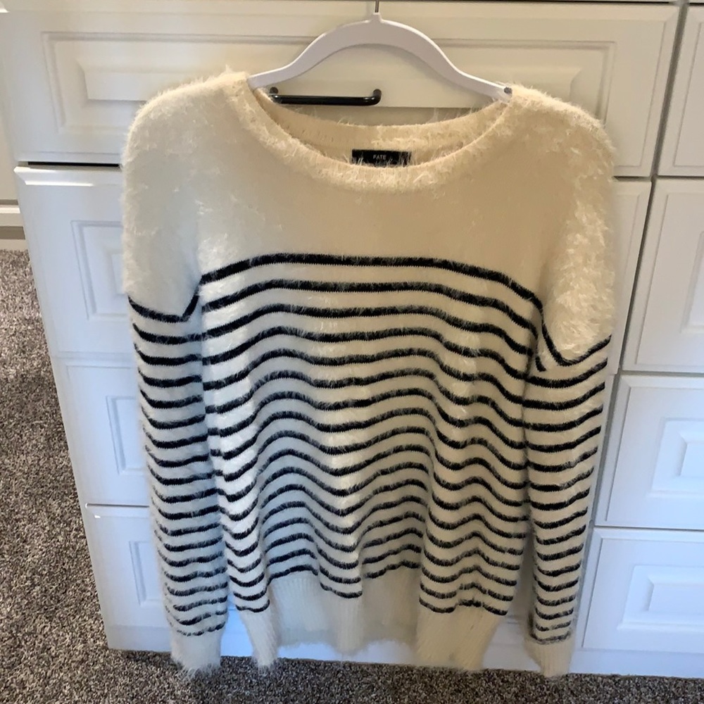 Fuzzy cream & black sweater. Size large.